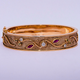 0.82ct Diamond, Ruby, & Peridot Unique Bangle in 9ct Yellow Gold