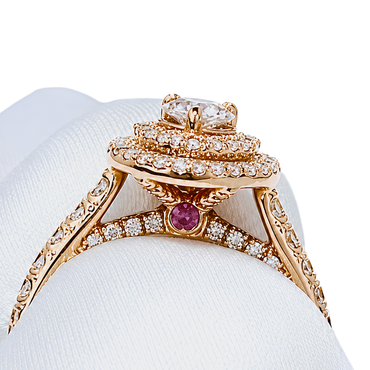 rose gold halo cluster ring with pear-cut centre and pink sapphire accent | LONDON LOANS